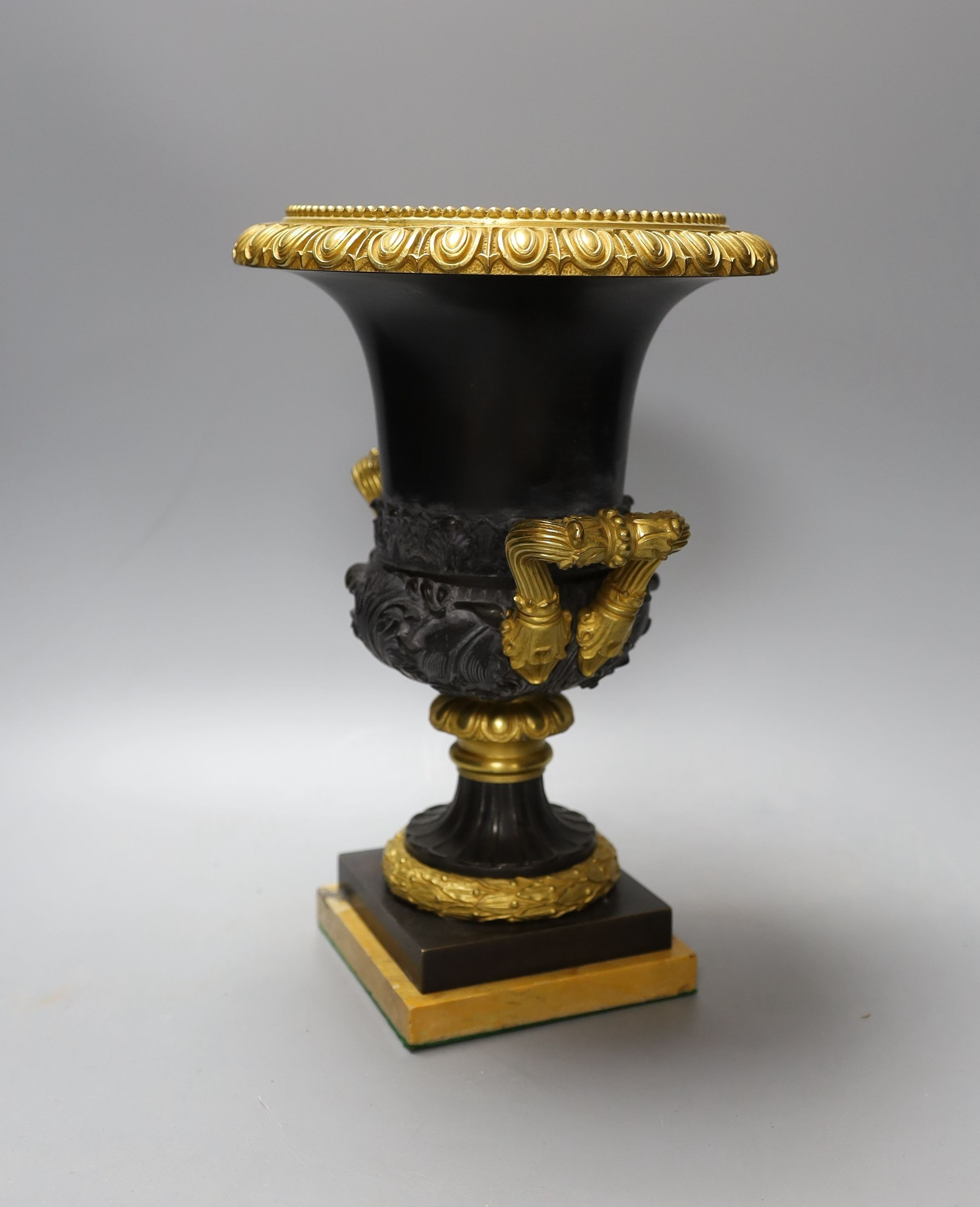 A Louis XVI style campana-shape bronze and ormolu urn, 28cm